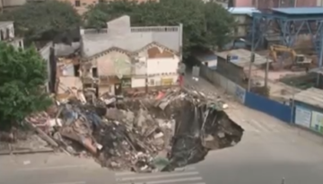 Giant Sinkhole Gobbles Up Building in China   1Funny.com