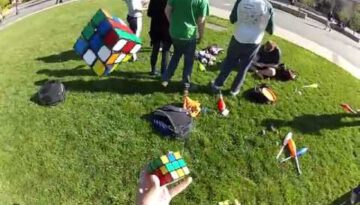 Solving 3 Rubik’s Cube While Juggling
