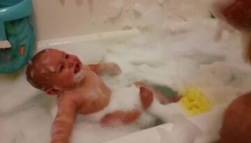 Baby Laughs When Dad Blows Bubbles in Baby’s Face