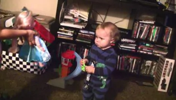 Baby Boy Really Likes His Sister’s Frozen Doll