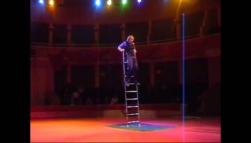 Wow!  Performer Balances on 18-Foot Ladder